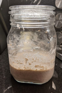 Jar with the beginning of a sourdough starter